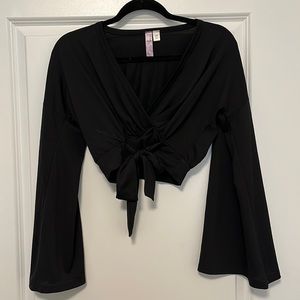 Cropped black top with bell sleeves